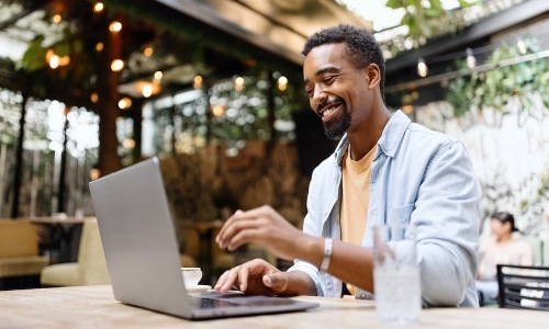 a man with his laptop outside
