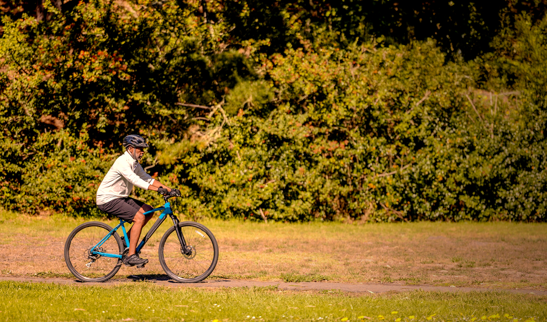 a man riding his bicycle